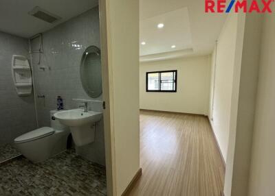 Photo of a bathroom and bedroom