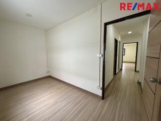 Empty bedroom with a hallway view