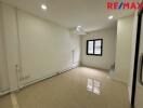 Unfurnished living room with tile flooring and recessed lighting