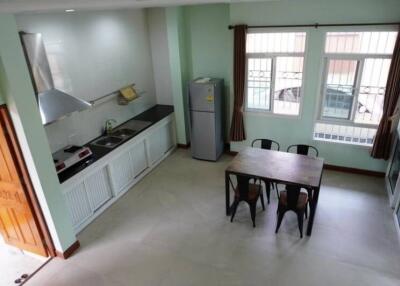 Modern kitchen and dining area with large windows