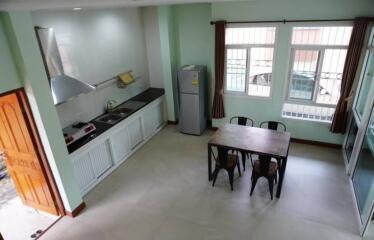 Modern kitchen and dining area with large windows