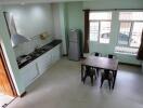 Modern kitchen and dining area with large windows