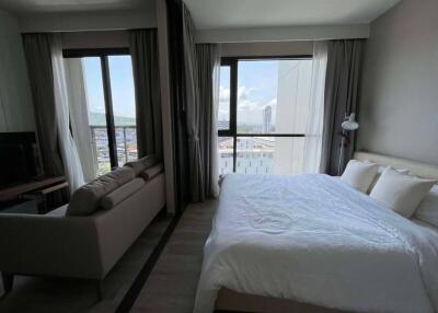 Bedroom with large windows and a scenic view