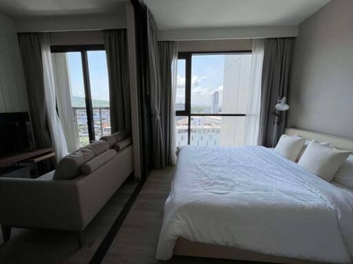 Bedroom with large windows and a scenic view