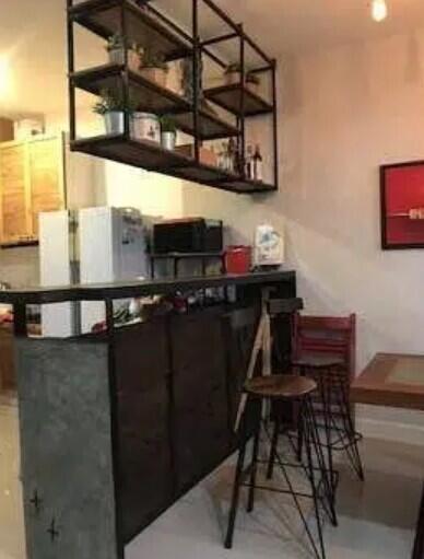 Modern kitchen with bar counter and stools