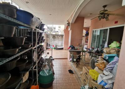 Utility room with storage shelves and miscellaneous items