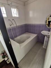 Bathroom with bathtub and sink