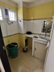 Small bathroom with yellow and white tiles