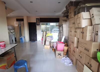 Photo of a cluttered storage room with boxes and various items