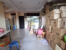 Photo of a cluttered storage room with boxes and various items