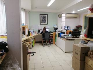 Office space with multiple desks and equipment