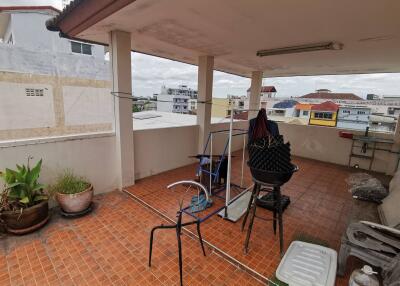 Spacious balcony with city views and tiled flooring.