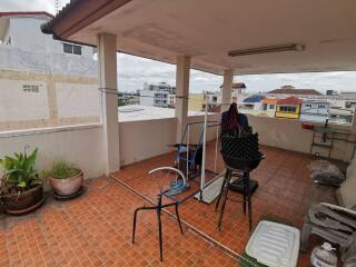 Spacious balcony with city views and tiled flooring.