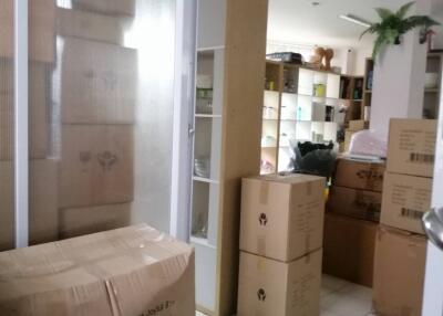 Room with packed boxes and storage shelves