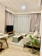 Modern living room with sofa, coffee table, and TV