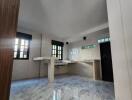 Bright kitchen with marble flooring and counter spaces