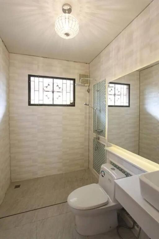 Bathroom with wall tiles and fittings