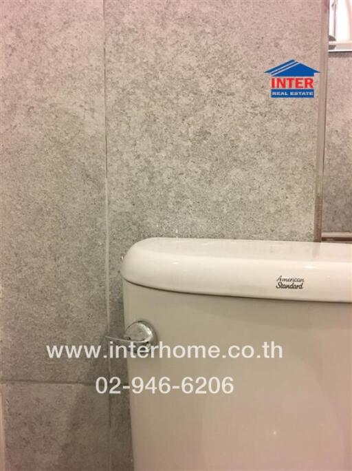 Bathroom with tiled walls and toilet
