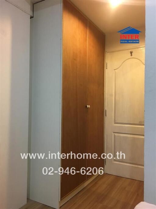 Hallway with a built-in wooden closet