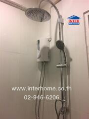 Shower area with water heater and dual shower heads