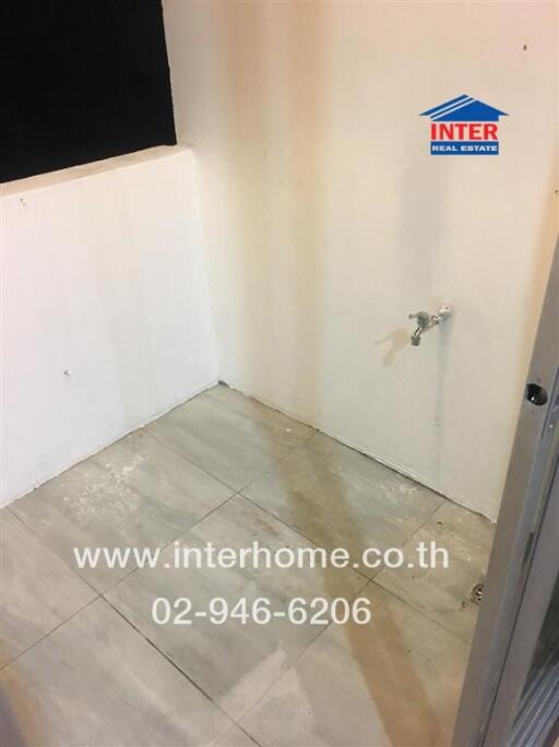 Empty bathroom space with incomplete wall and floor tiling