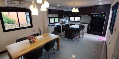 Modern kitchen with dining table and appliances
