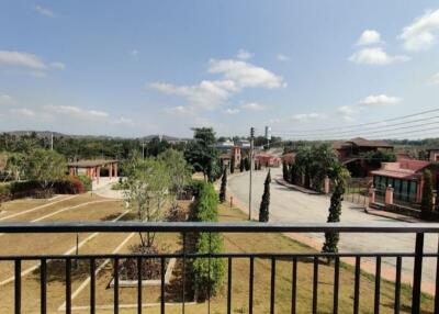 View from balcony showing street and neighborhood