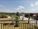 View from balcony showing street and neighborhood