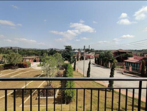 View from balcony showing street and neighborhood