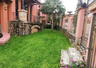 Outdoor garden area with stone pathway and greenery