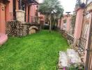 Outdoor garden area with stone pathway and greenery