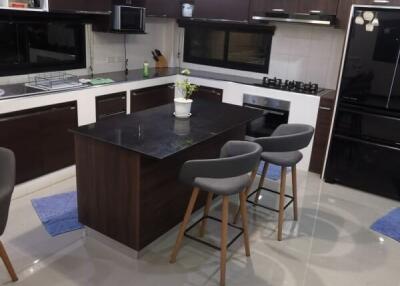 Modern kitchen with island and bar stools