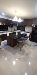 Modern kitchen with island and bar stools