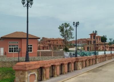 Exterior view of residential buildings with street lamps and walkway