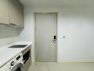 Laundry area with washing machine and storage cabinets