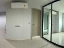 Modern apartment with mirrored sliding doors and air conditioning