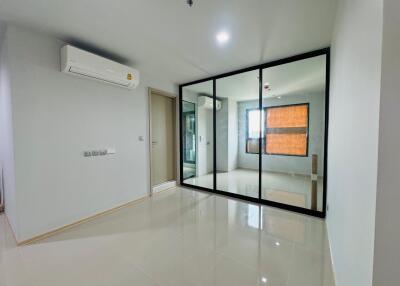 Bedroom with large mirrored wardrobe and air conditioning