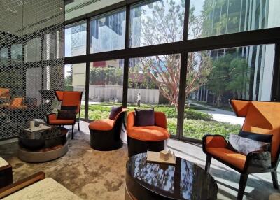 Modern living room with large windows and garden view