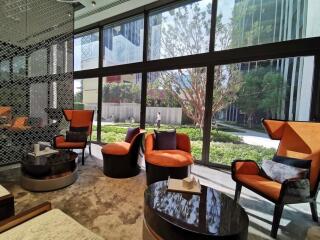 Modern living room with large windows and garden view