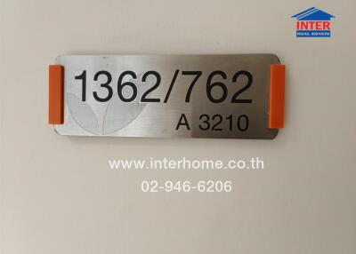 Building sign with contact information and unit number