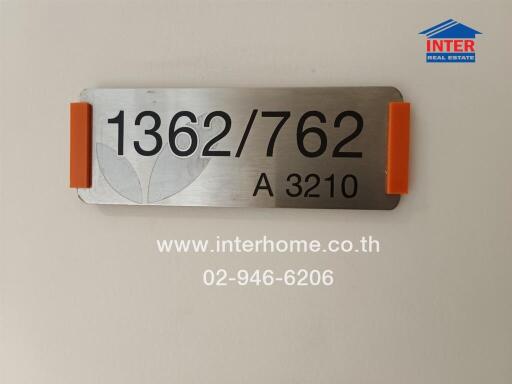 Building sign with contact information and unit number