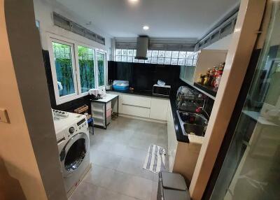 Modern kitchen with large windows and appliances