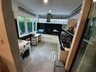 Modern kitchen with large windows and appliances