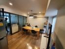 Modern dining room with wooden floor and glass wall