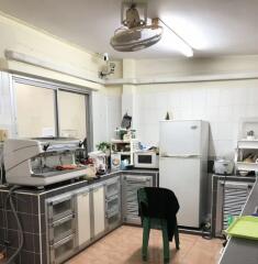 Well-equipped kitchen with appliances and storage