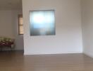 Living room with wooden flooring and frosted glass window