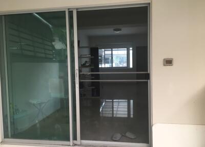 Glass sliding doors leading to an interior space