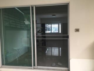 Glass sliding doors leading to an interior space