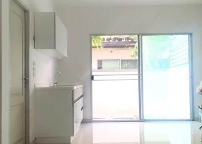 Bright and modern kitchen area with sliding glass doors