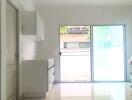 Bright and modern kitchen area with sliding glass doors